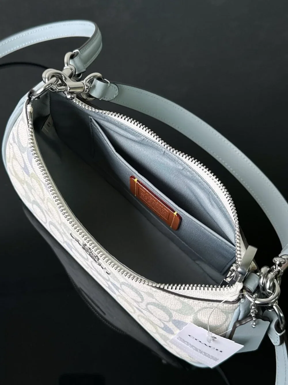 Coach signature coated‑canvas